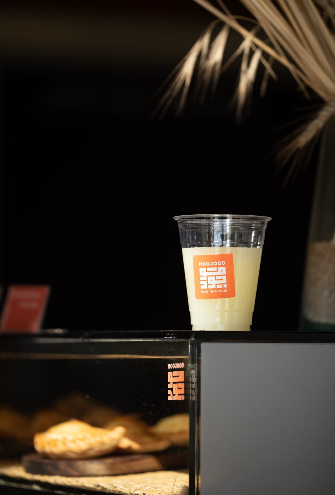 Moojood lemonade cup on the counter display.