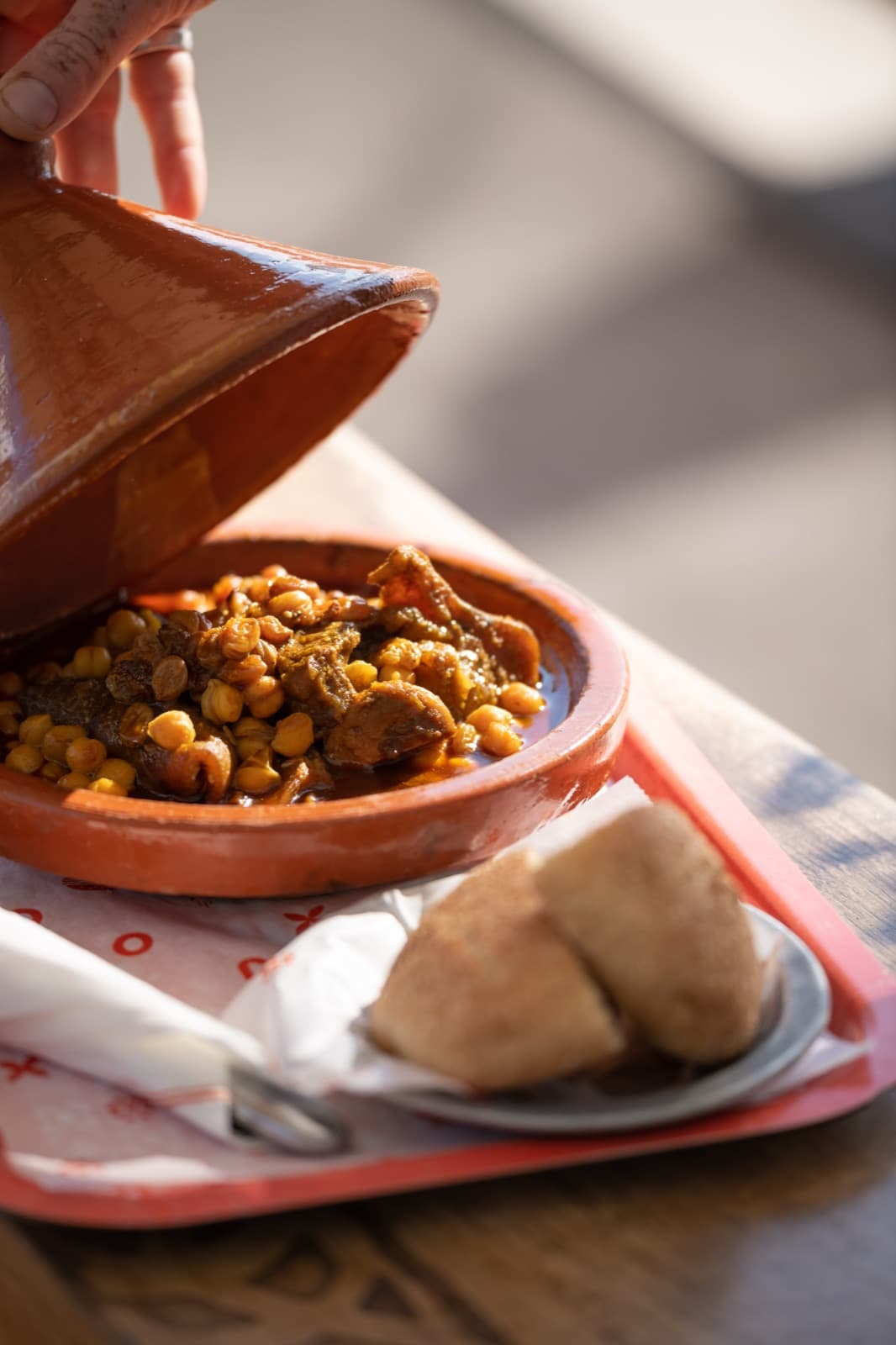 Slow-cooked starter tagine, served with beldi bread on a Moojood tray.